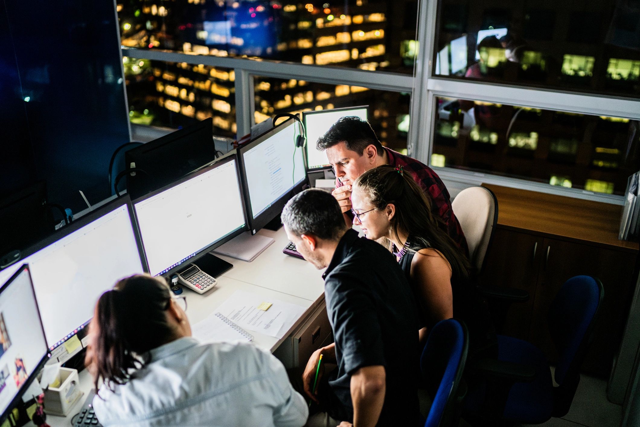 Security team collaborating in an operations center